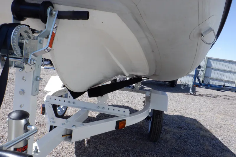 Slide: The Image of 2015 Walker Bay Odyssey 325 ST boat on trailer, close-up view. - 8
