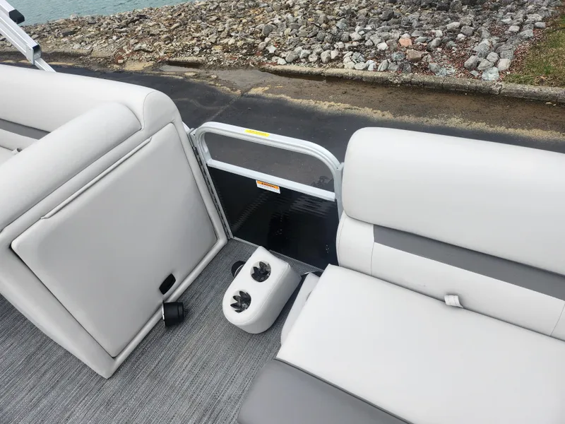 Slide: The Image of Interior of 2021 Godfrey Sweetwater 2086 C pontoon boat with gray seating and cup holders. - 10