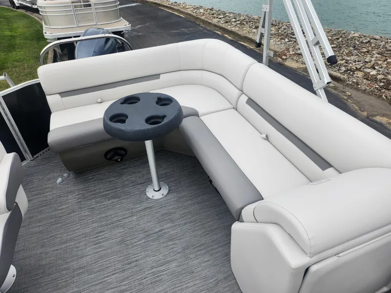 Slide: The Image of 2021 Godfrey Sweetwater 2086 C pontoon boat with gray seating and cup holder table. - 11