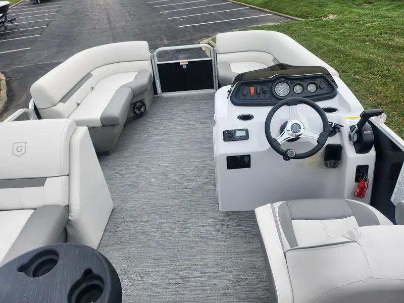 Slide: The Image of 2021 Godfrey Sweetwater 2086 C pontoon boat interior with seating and steering console. - 17