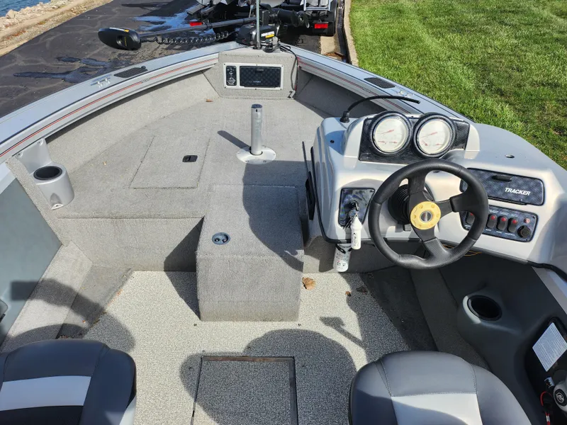 Slide: The Image of 2007 Tracker Targa 175 SC boat interior with steering wheel and dashboard controls. - 13
