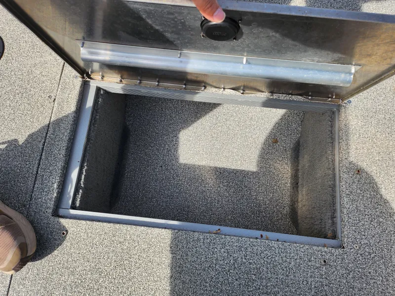 Slide: The Image of Open storage compartment on 2007 Tracker Targa 175 SC boat deck. - 16