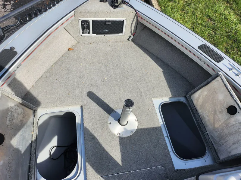Slide: The Image of 2007 Tracker Targa 175 SC boat interior with storage compartments and pedestal base. - 19