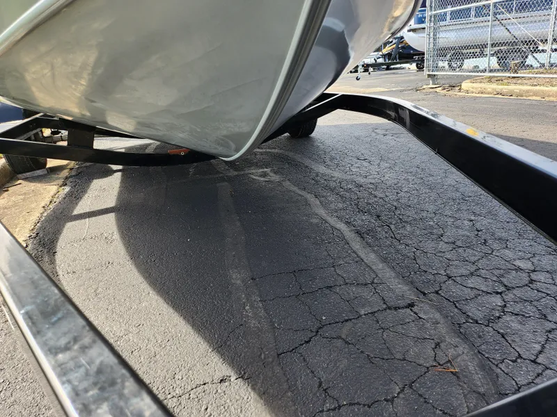 Slide: The Image of 2007 Tracker Targa 175 SC boat on trailer, parked on cracked asphalt. - 8