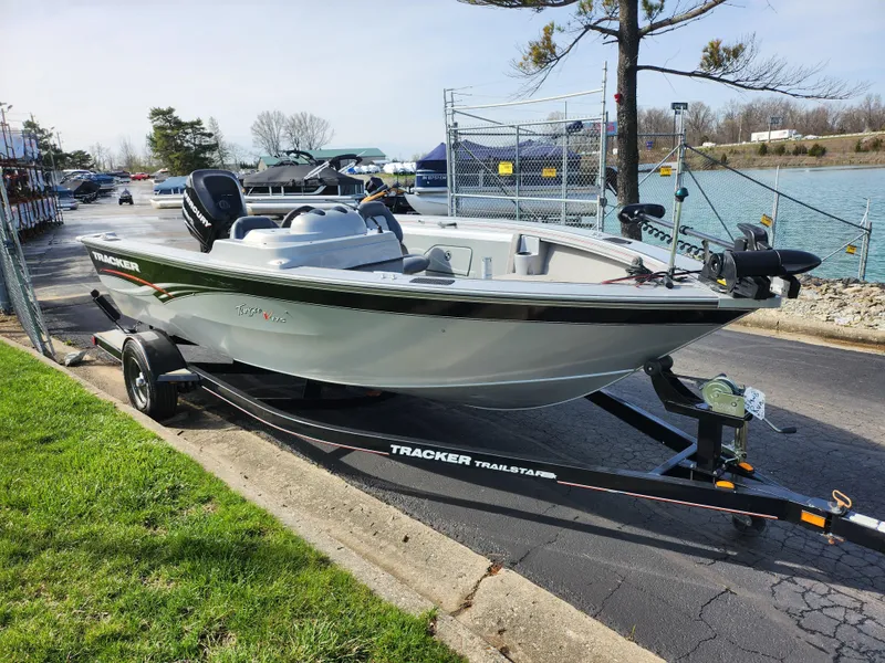 Slide: The Image of 2007 Tracker Targa 175 SC boat on trailer by a lakeside road. - 9