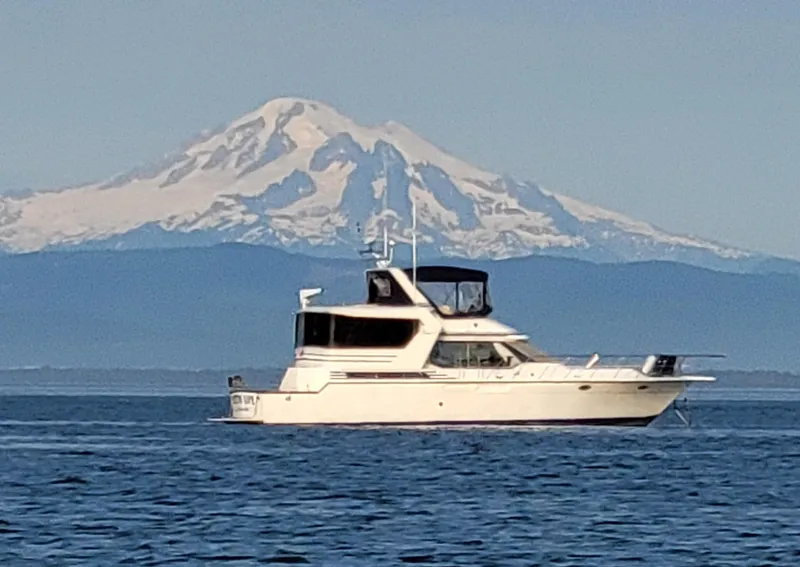 The Image of 1989 Prima 52 Cockpit Motor Yacht on water with mountain backdrop. - 0