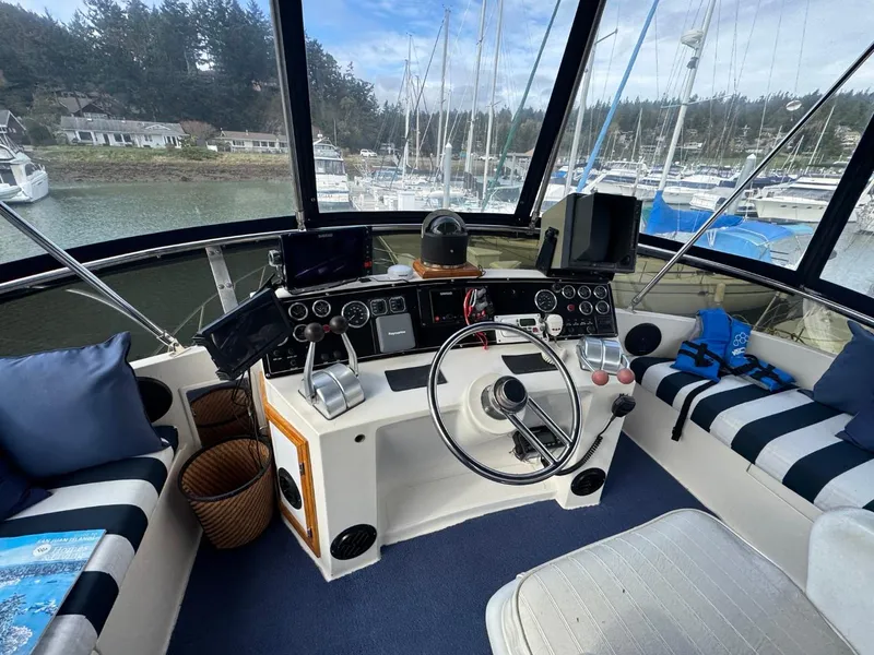 Slide: The Image of Cockpit of 1989 Prima 52 Motor Yacht with steering wheel and navigation equipment. - 21