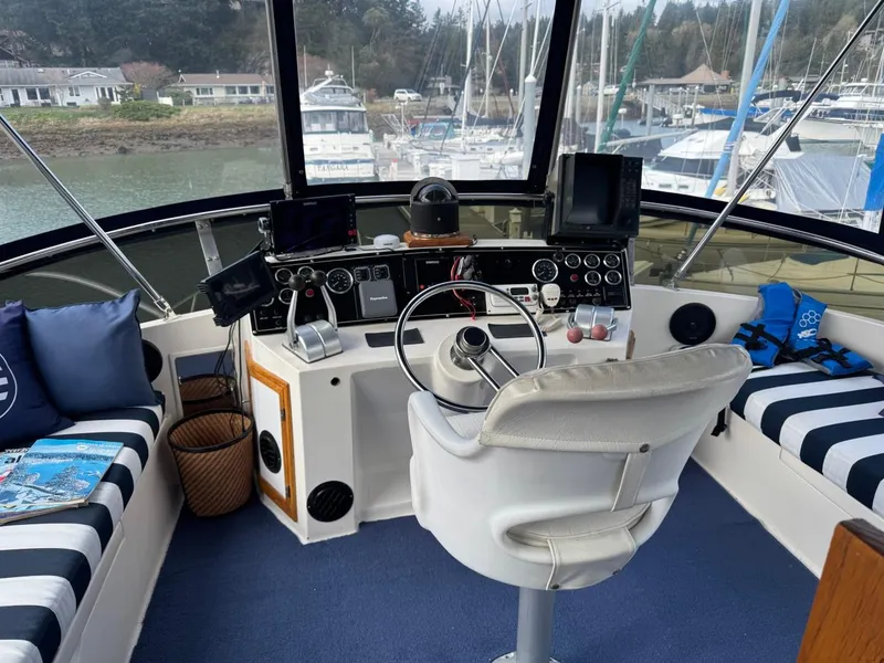 Slide: The Image of Cockpit of 1989 Prima 52 Motor Yacht with steering wheel and navigation equipment. - 22