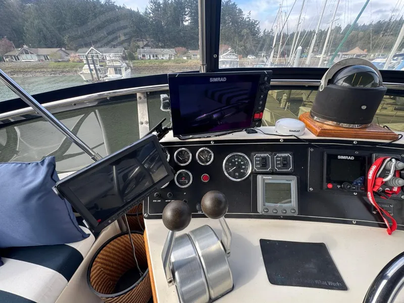 Slide: The Image of Cockpit of 1989 Prima 52 Motor Yacht with navigation equipment and controls. - 23