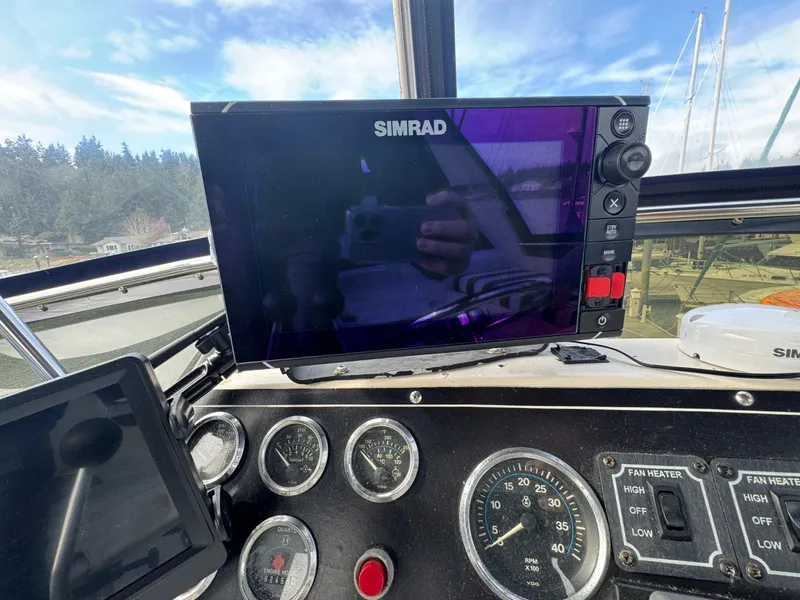 Slide: The Image of Cockpit dashboard of 1989 Prima 52 Motor Yacht with Simrad navigation display. - 24