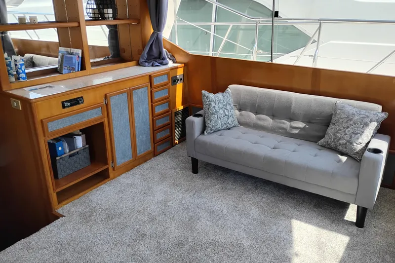 Slide: The Image of Interior of 1989 Prima 52 Cockpit Motor Yacht with sofa and wooden cabinetry. - 37