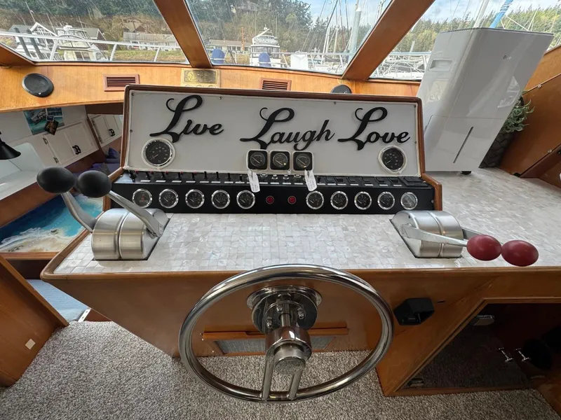 Slide: The Image of Cockpit of 1989 Prima 52 Motor Yacht with "Live Laugh Love" sign. - 38