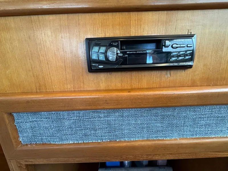 Slide: The Image of Built-in stereo system on 1989 Prima 52 Cockpit Motor Yacht wooden panel. - 41