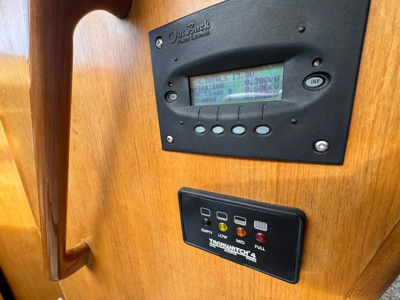 Slide: The Image of Control panel on 1989 Prima 52 Cockpit Motor Yacht, featuring OutBack Power Systems display. - 42