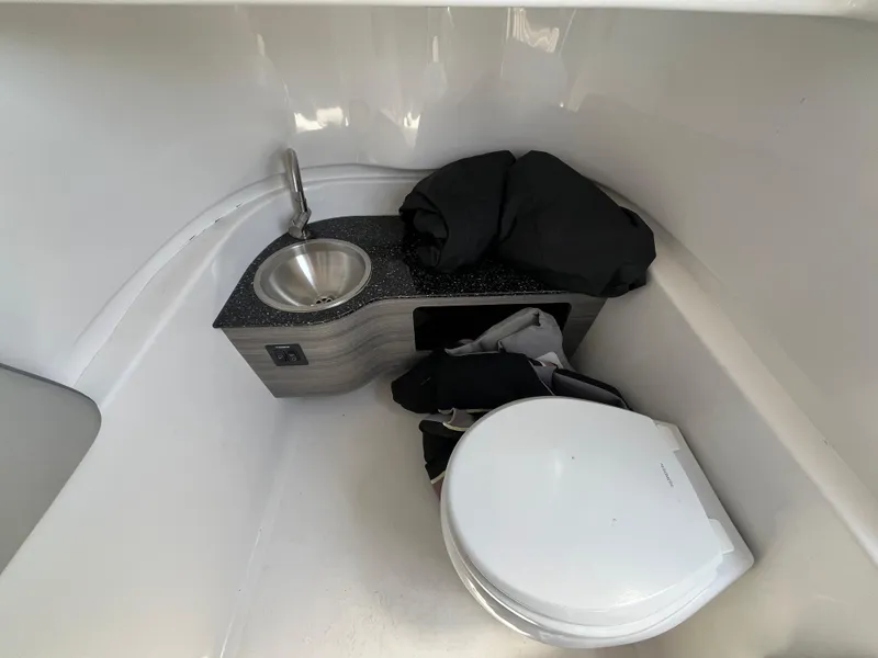 Slide: The Image of 2022 Seapro 320 DLX boat interior with sink and toilet. - 19