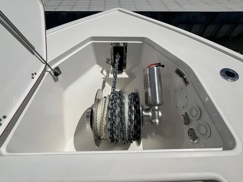 Slide: The Image of Anchor compartment of 2022 Seapro 320 DLX boat with chain and winch system. - 20
