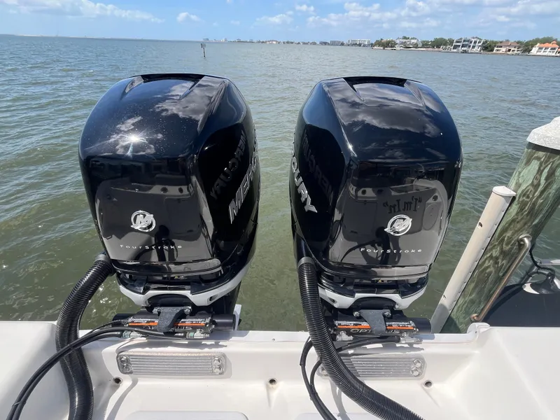 Slide: The Image of Twin Mercury outboard engines on a 2022 Seapro 320 DLX boat, ocean backdrop. - 33