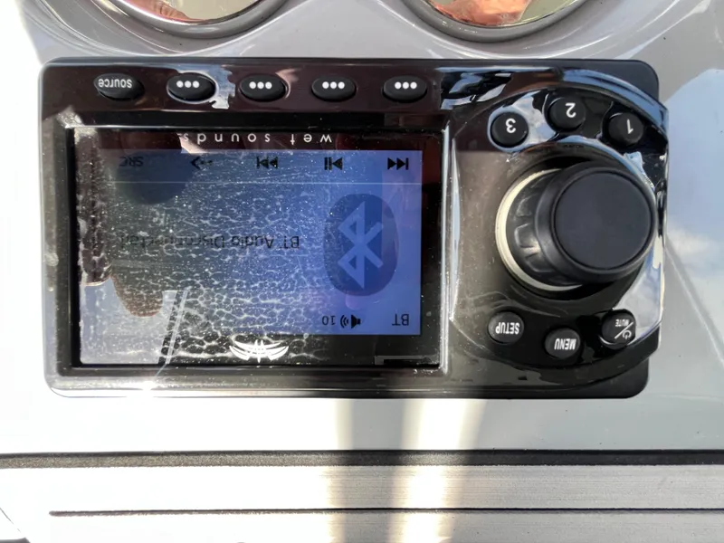 Slide: The Image of Close-up of a Seapro 320 DLX 2022 boat stereo system with Bluetooth connectivity. - 35