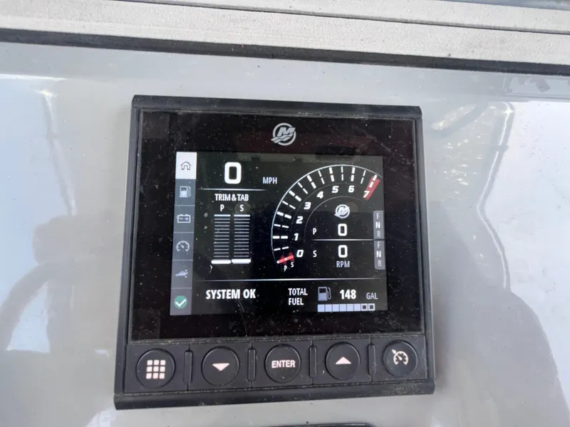 Slide: The Image of Seapro 320 DLX 2022 dashboard display showing speed, RPM, and fuel level. - 39