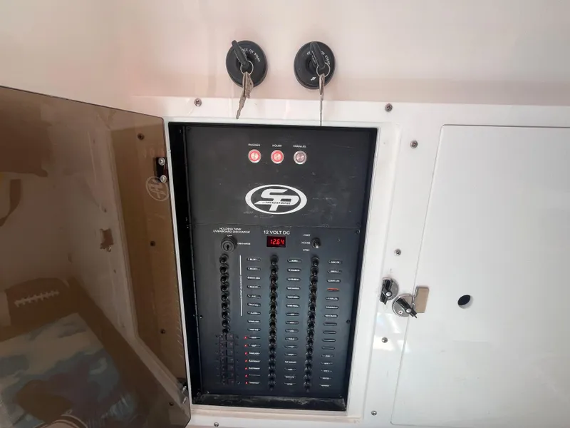 Slide: The Image of Electrical panel of 2022 Seapro 320 DLX boat with switches and controls. - 40