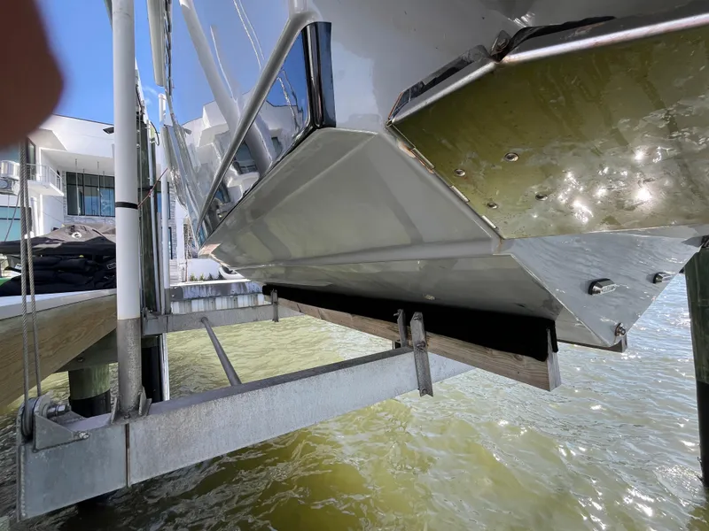 Slide: The Image of 2022 Seapro 320 DLX boat hull on lift, dockside view. - 41