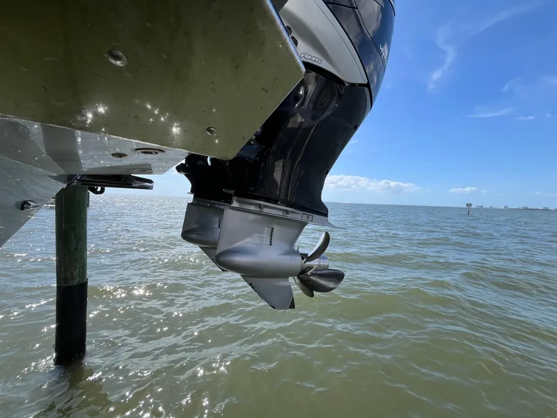 Slide: The Image of Outboard motor of 2022 Seapro 320 DLX boat over water under clear sky. - 43