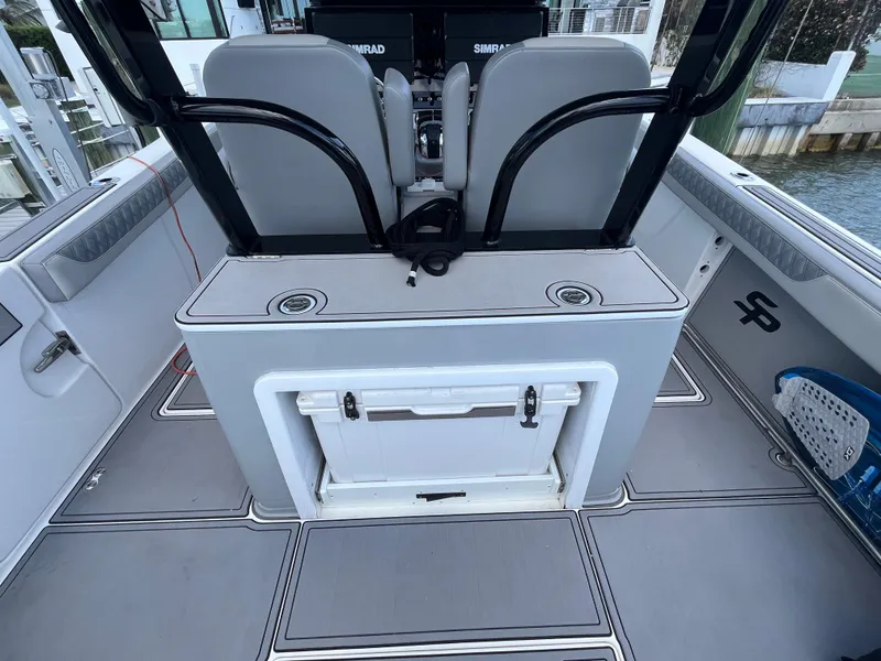 Slide: The Image of 2022 Seapro 320 DLX boat interior with seating and storage compartments. - 5