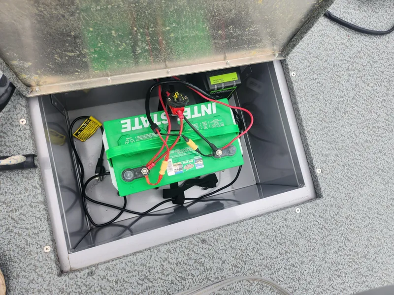 Slide: The Image of Battery compartment of a 2016 G3 Eagle 166 boat with Interstate battery. - 16