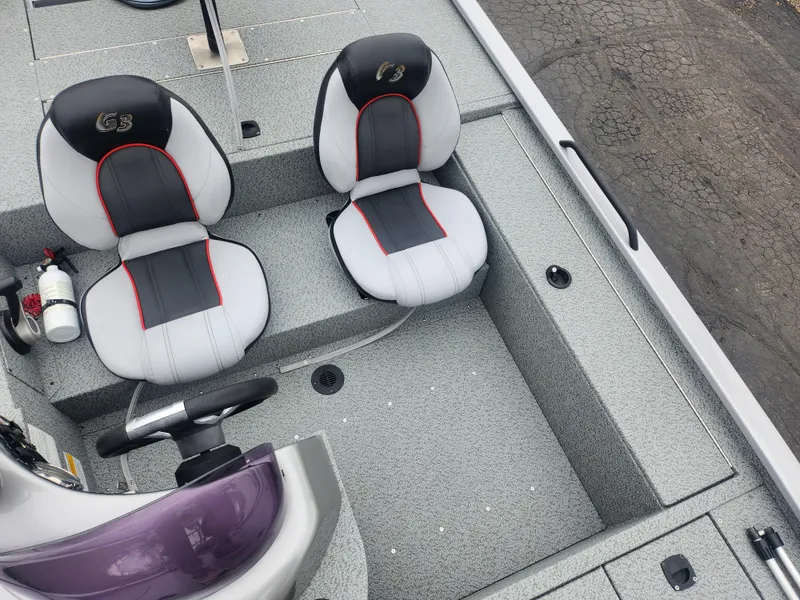 Slide: The Image of 2016 G3 Eagle 166 boat interior with dual seats and steering wheel. - 20