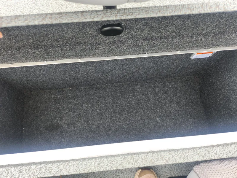 Slide: The Image of Storage compartment of a 2016 G3 Eagle 166 boat, open and empty. - 23