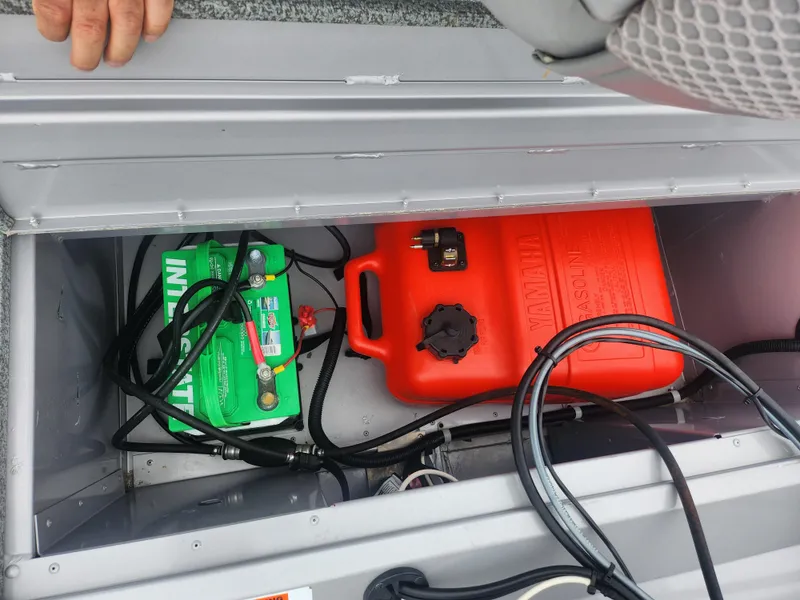 Slide: The Image of Battery and fuel tank inside a 2016 G3 Eagle 166 boat compartment. - 24