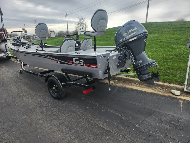 Slide: The Image of 2016 G3 Eagle 166 boat with Yamaha motor on trailer, parked on asphalt. - 3