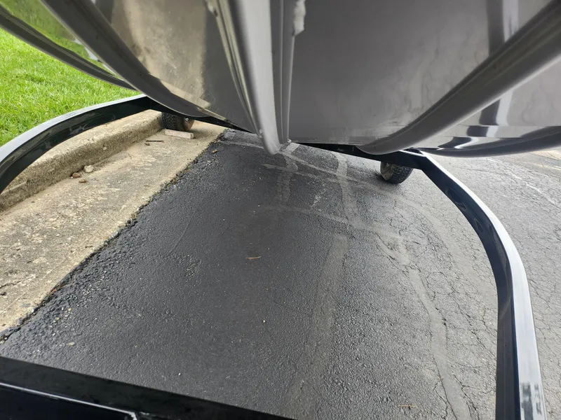 Slide: The Image of 2016 G3 Eagle 166 boat on trailer, close-up view of hull and pavement. - 8