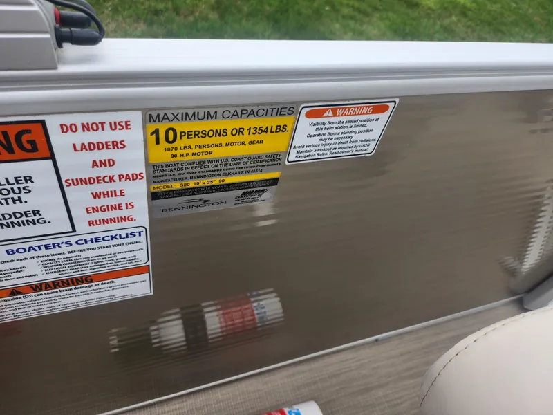 Slide: The Image of 2017 Bennington 20 SLMX capacity warning label, maximum 10 persons or 1354 lbs. - 13