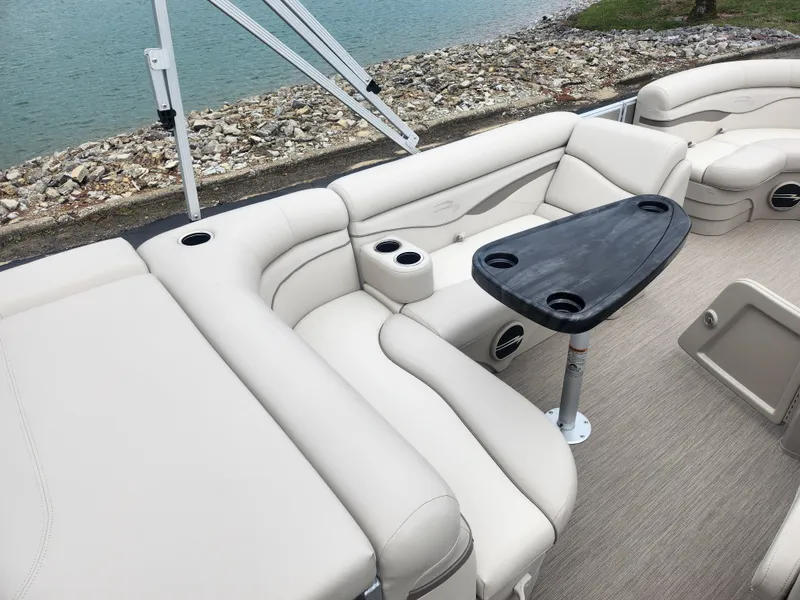 Slide: The Image of Luxurious seating on a 2017 Bennington 20 SLMX pontoon boat with a sleek table. - 17