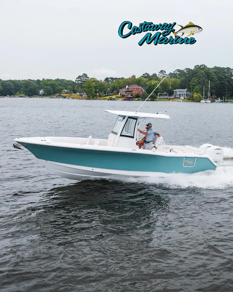 Slide: The Image of 2025 Sea Hunt Gamefish 27 with Coffin Box cruising on a lake, Castaway Marine logo visible. - 20