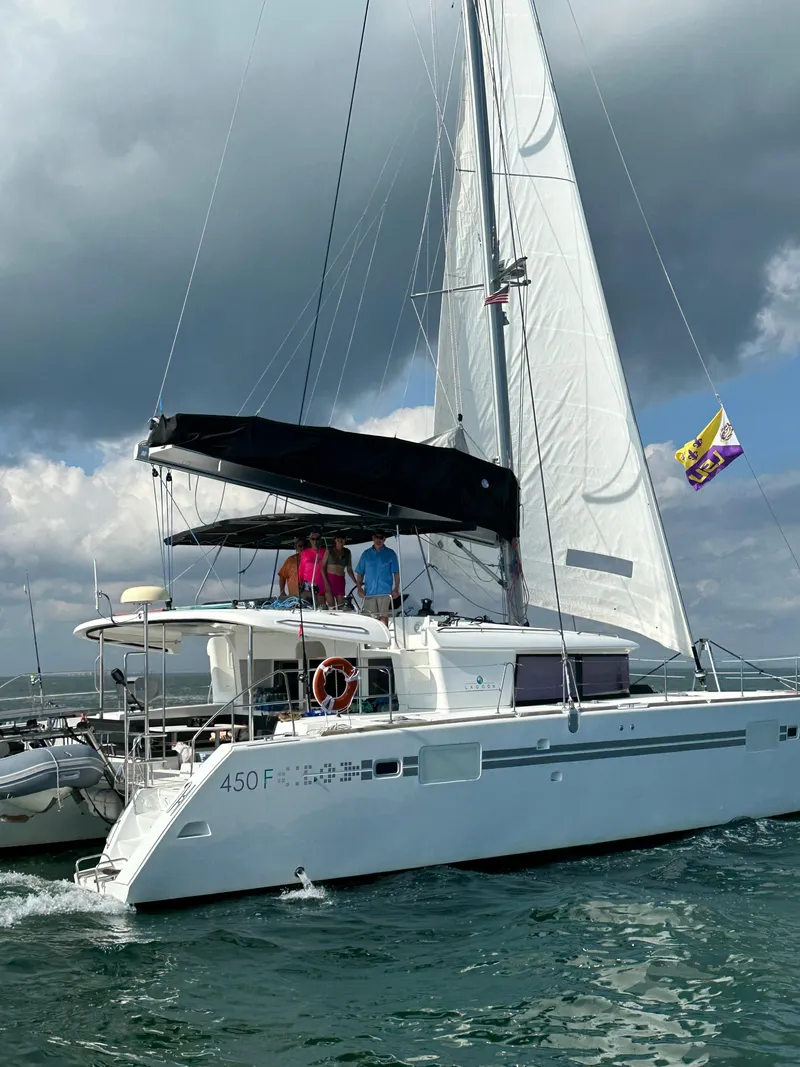 Slide: The Image of 2017 Lagoon 450 F catamaran sailing on open water under cloudy skies. - 1