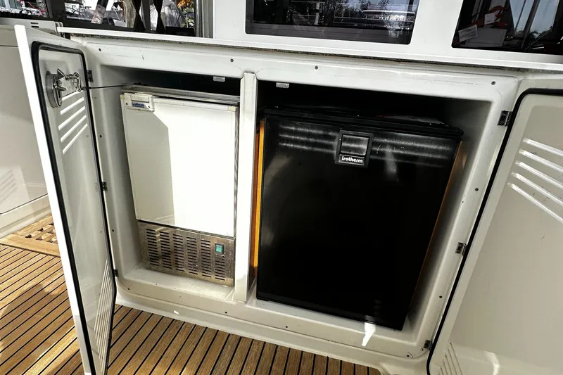 Slide: The Image of Outdoor storage compartment on a 2017 Lagoon 450 F yacht with built-in appliances. - 16