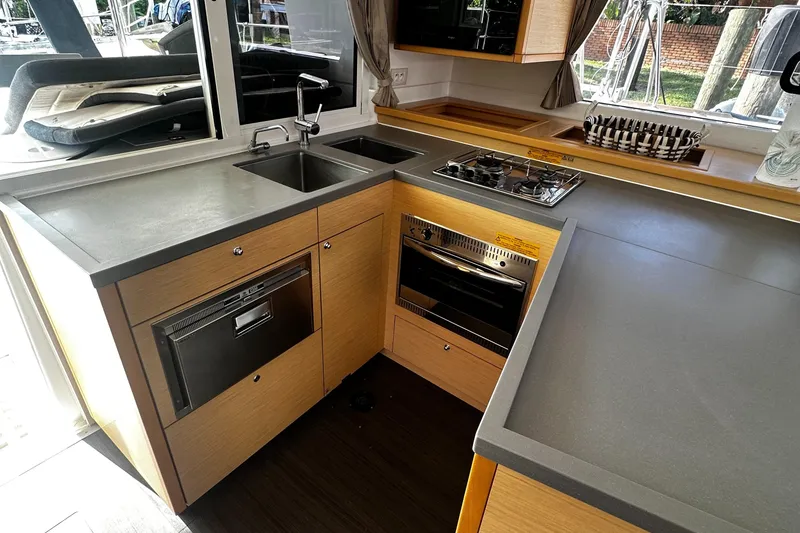 Slide: The Image of Modern kitchen in 2017 Lagoon 450 F yacht with sleek countertops and appliances. - 22