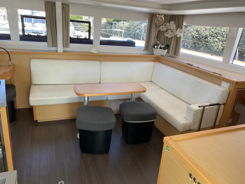 Slide: The Image of Interior of 2017 Lagoon 450 F catamaran with modern seating and natural light. - 24