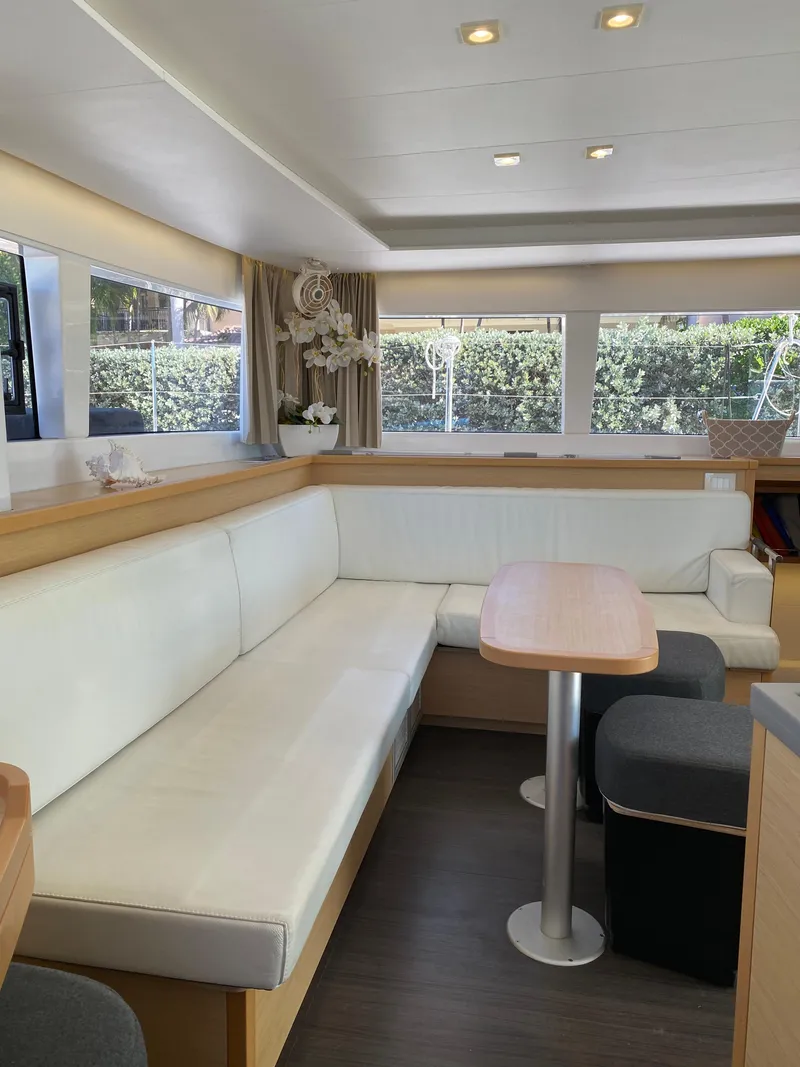 Slide: The Image of Interior of 2017 Lagoon 450 F yacht with modern seating and natural light. - 26
