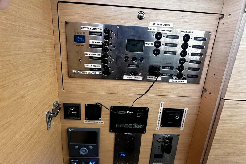 Slide: The Image of Control panel of a 2017 Lagoon 450 F yacht, featuring various switches and displays. - 27