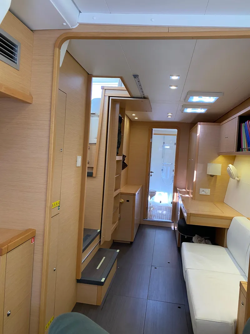 Slide: The Image of Interior of 2017 Lagoon 450 F catamaran, featuring modern design and cozy seating area. - 28