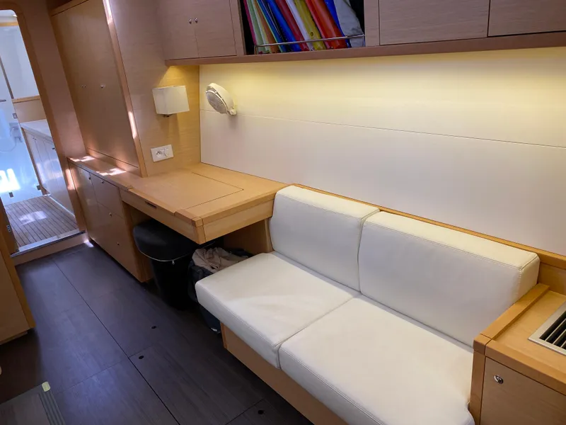 Slide: The Image of Interior of 2017 Lagoon 450 F yacht with white seating and wooden cabinetry. - 31