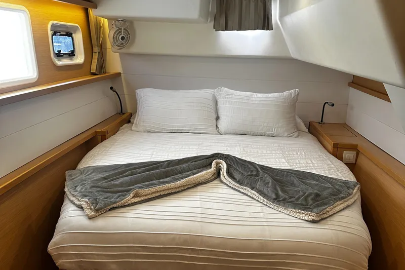 Slide: The Image of Cozy cabin interior of 2017 Lagoon 450 F catamaran with neatly made bed. - 32