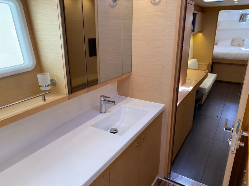 Slide: The Image of Spacious interior of 2017 Lagoon 450 F catamaran with modern bathroom and cozy bedroom. - 35