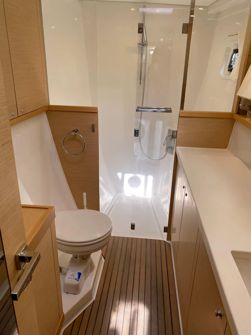 Slide: The Image of 2017 Lagoon 450 F yacht bathroom with modern fixtures and wooden accents. - 37