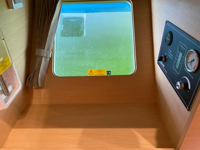 Slide: The Image of Interior view of 2017 Lagoon 450 F yacht cabin with window and control panel. - 39