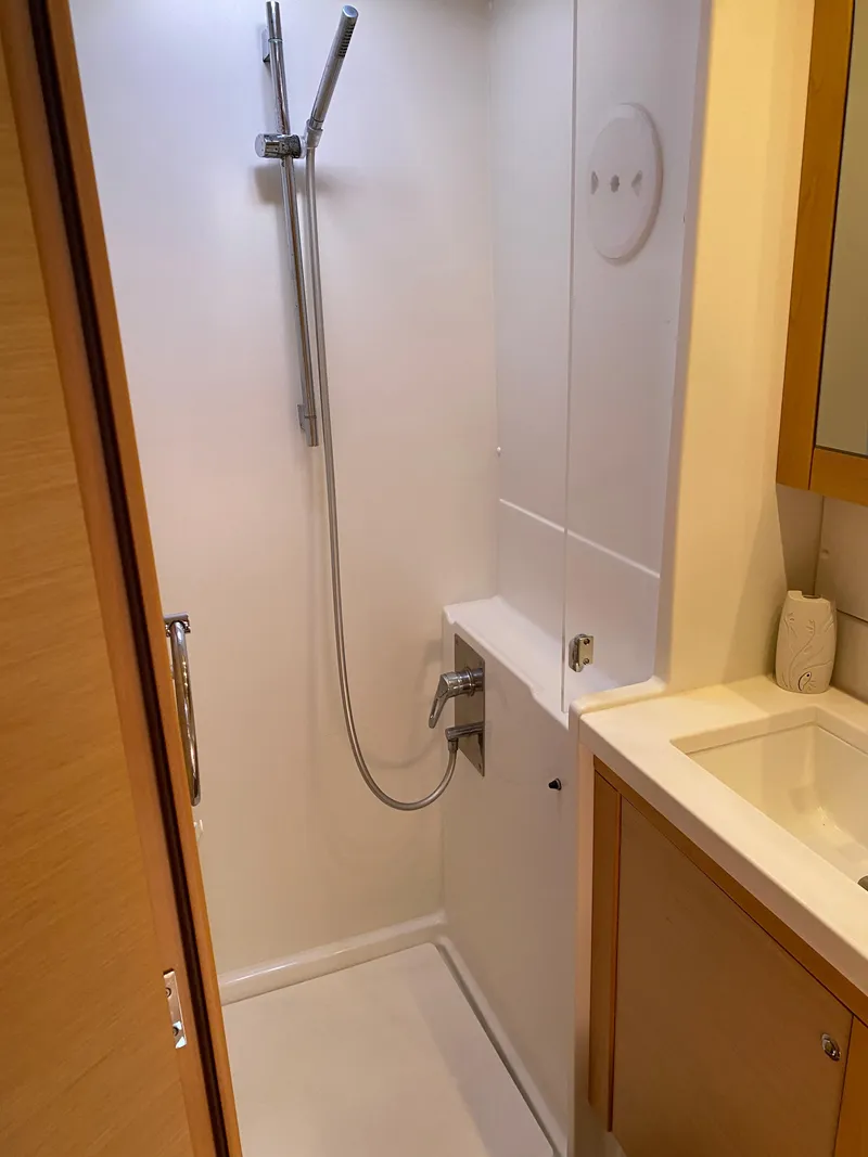 Slide: The Image of 2017 Lagoon 450 F yacht bathroom with modern shower and sink. - 40