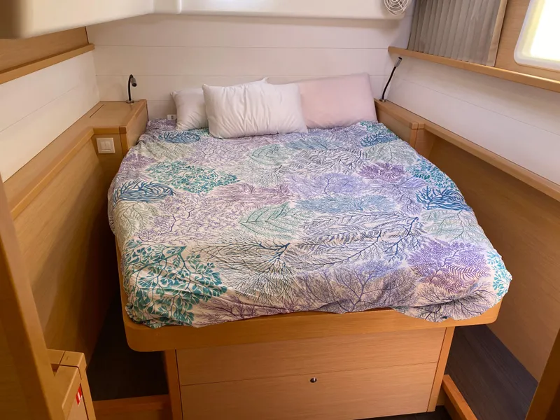 Slide: The Image of Cozy cabin bedroom in 2017 Lagoon 450 F catamaran with colorful bedding. - 41